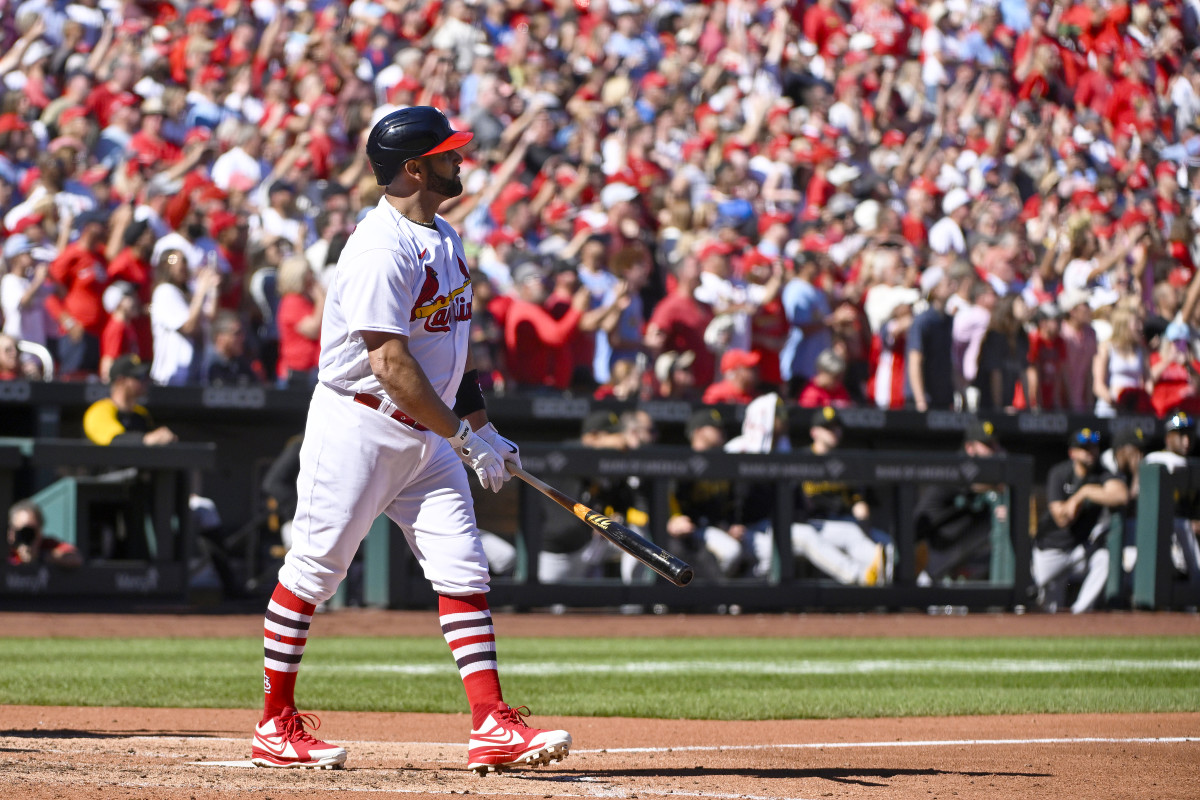 Albert Pujols watches his 702nd career home run go over the fence at Busch Stadium.
